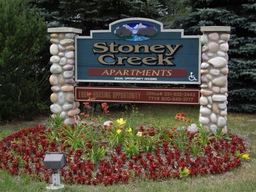 Stoney Creek apartments sign and flower decoration