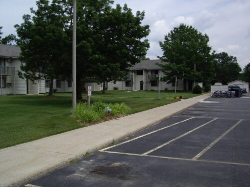 Village Green Apartments front pitch road