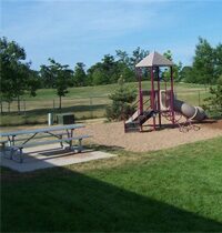 Thorntree Apartments playground with green grasswood