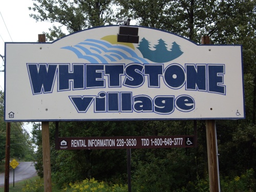 Whetstone Village Apartments entrance hording