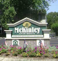 McKinley Apartments Sign White and Green