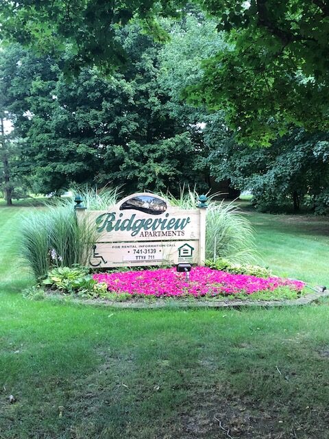 Ridgeview apartment sign and garden