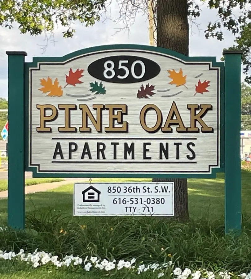 Pine Oak Apartments Sign and exterior