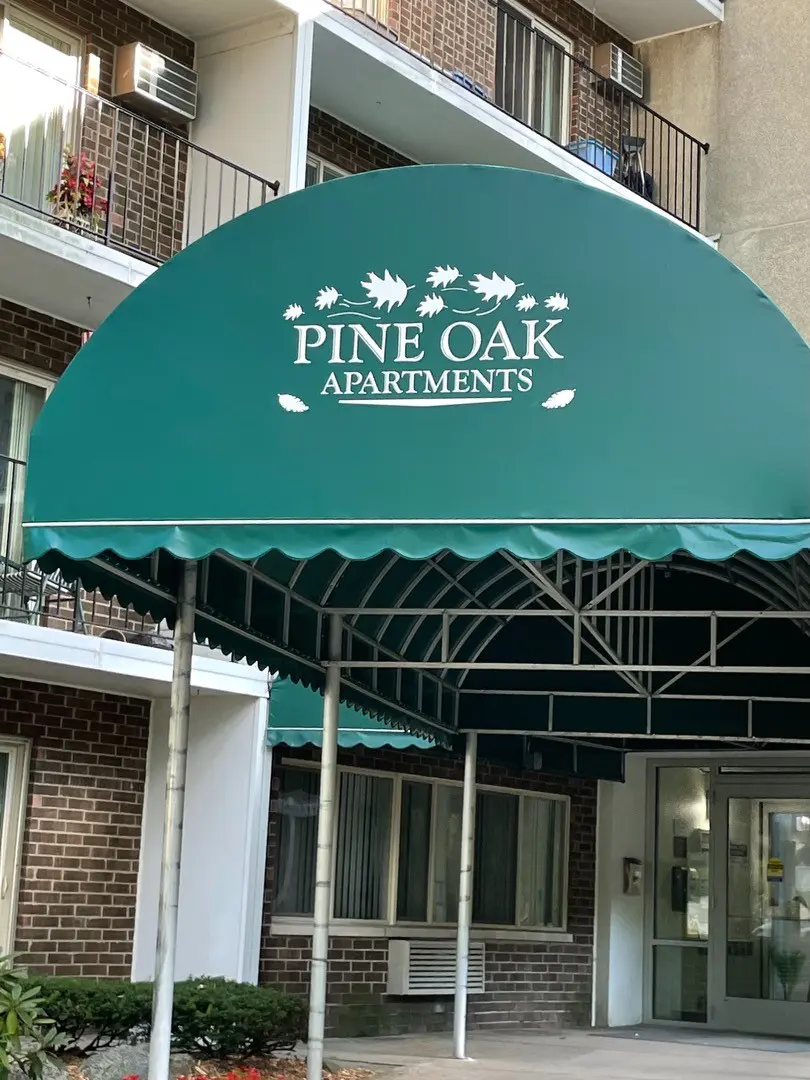 Pine Oak Apartments sign and entry