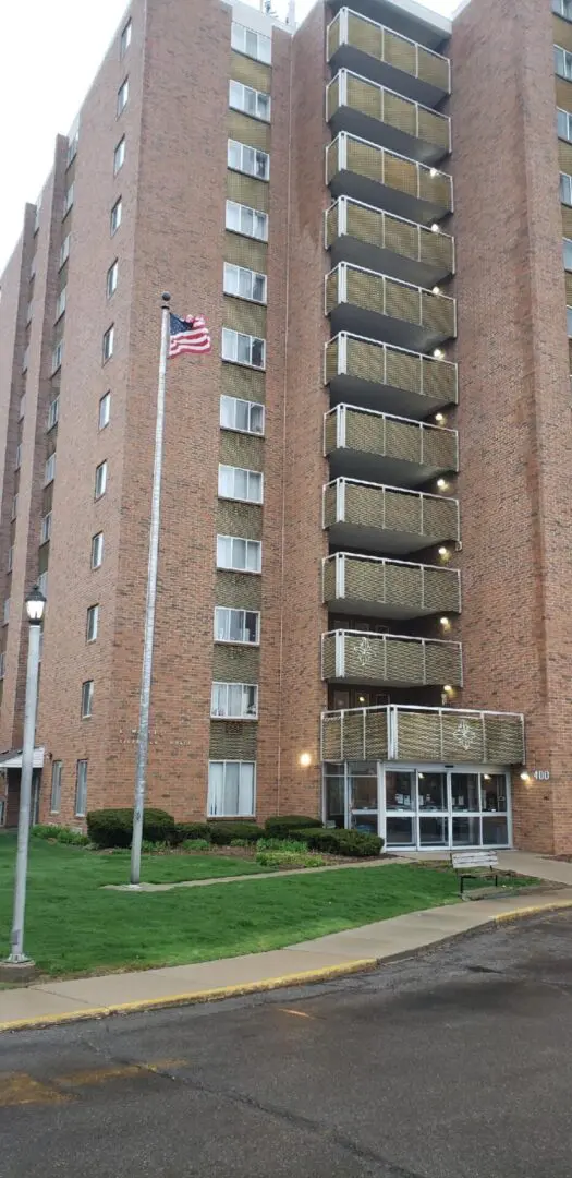 Riverview Terrace exterior view and flags
