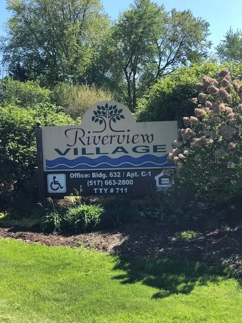 Riverview Village Sign and garden flowers