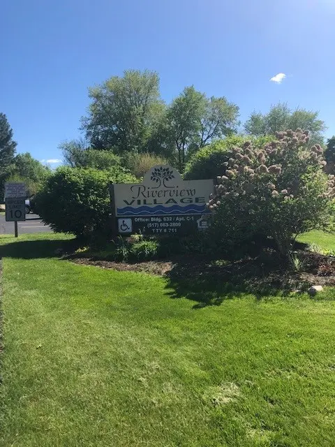 Riverview Village Sign Board and Green Grass